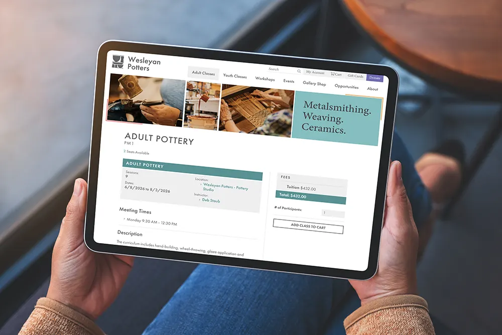 Person holding a tablet displaying a screen for course registration.