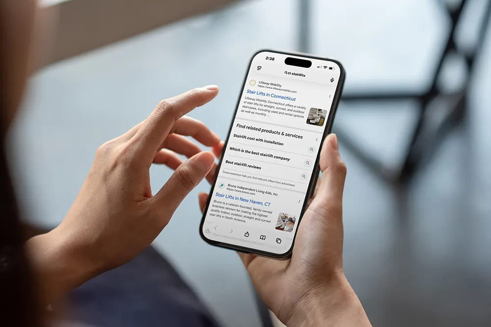 Person on their smartphone viewing organic search results.